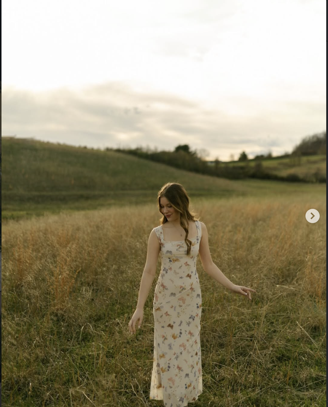 Portrait in floral dress, back view
